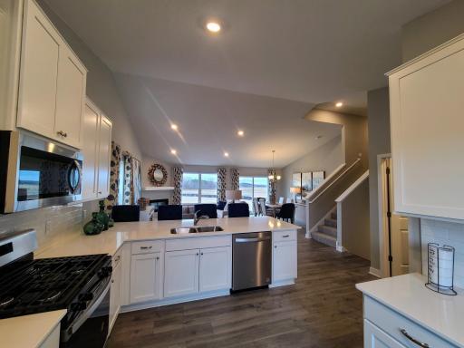 Stainless steel appliances and quartz countertops. Photo is of model home. Colors and options may vary. Ask Sales Agent for details.