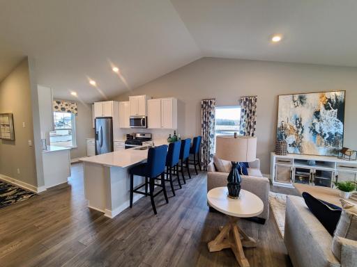 This functional kitchen boasts 42' cabinets with hardware, stainless steel appliances and quartz countertops. Photo is of model home. Colors and options may vary. Ask Sales Agent for details.