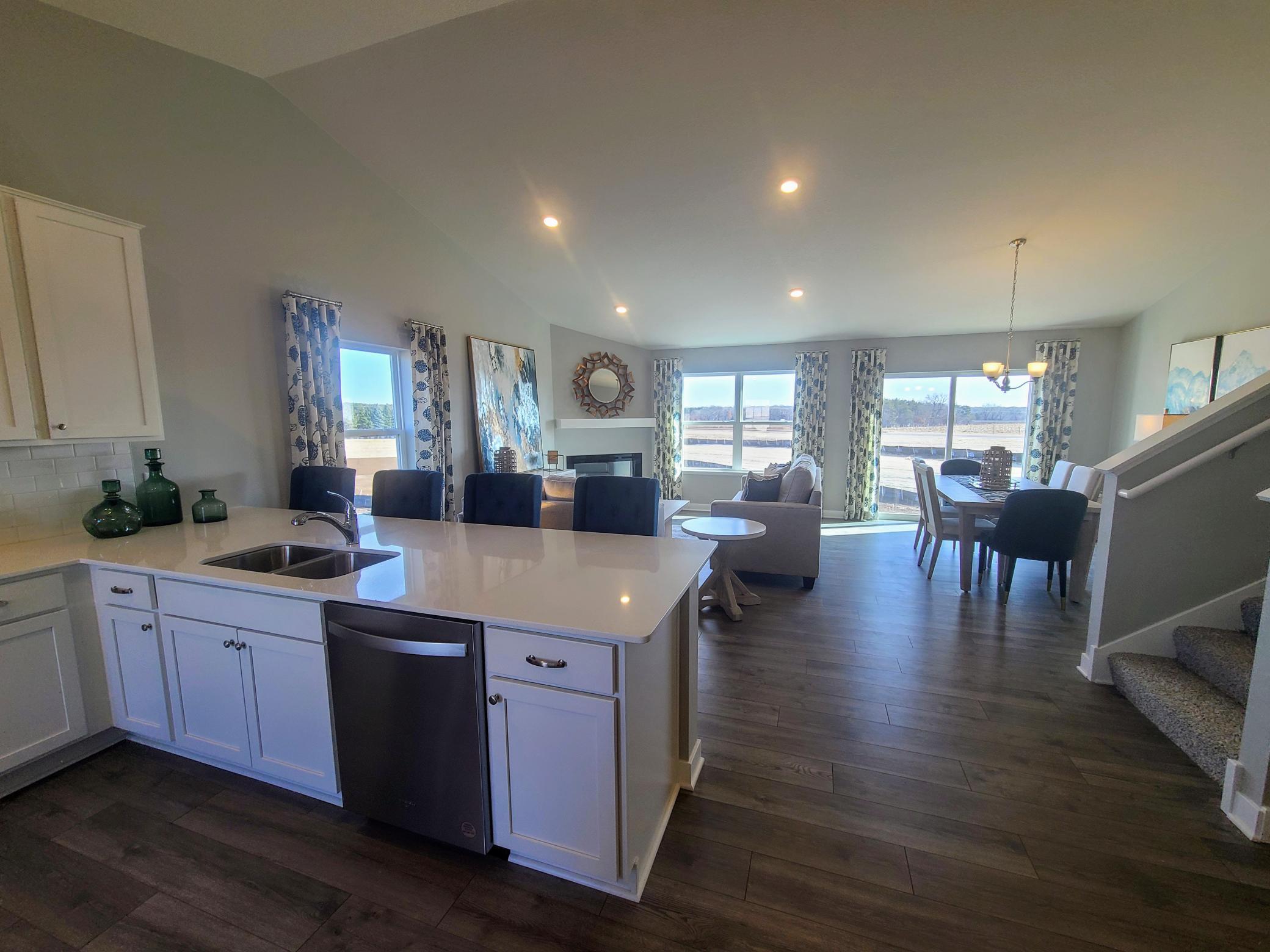 Open concept design with this large peninsula gives plenty space for entertaining. Photo is of model home. Colors and options may vary. Ask Sales Agent for details.