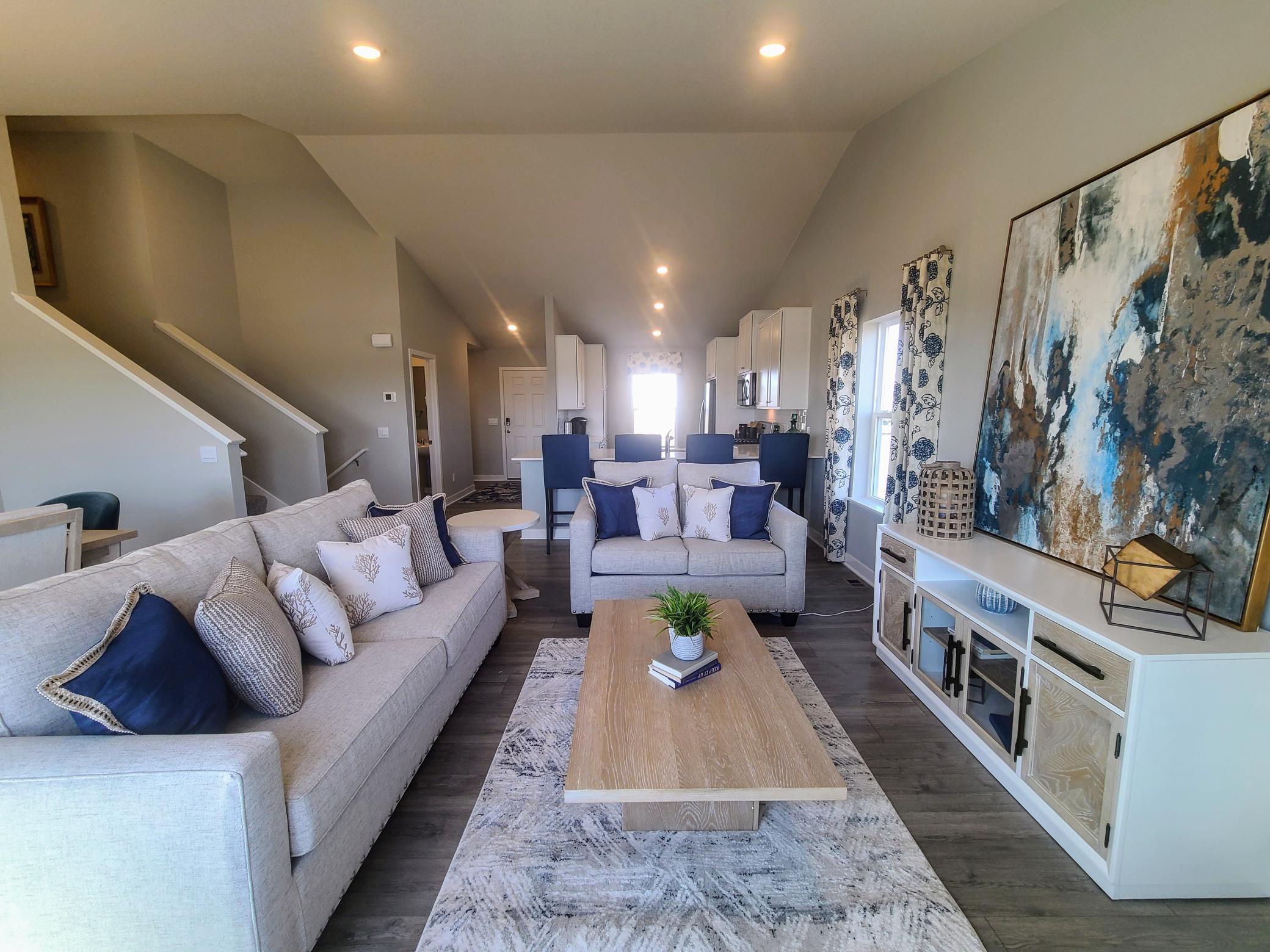 Open concept living with many ways to arrange furniture. Photo is of model home. Colors and options may vary. Ask Sales Agent for details.
