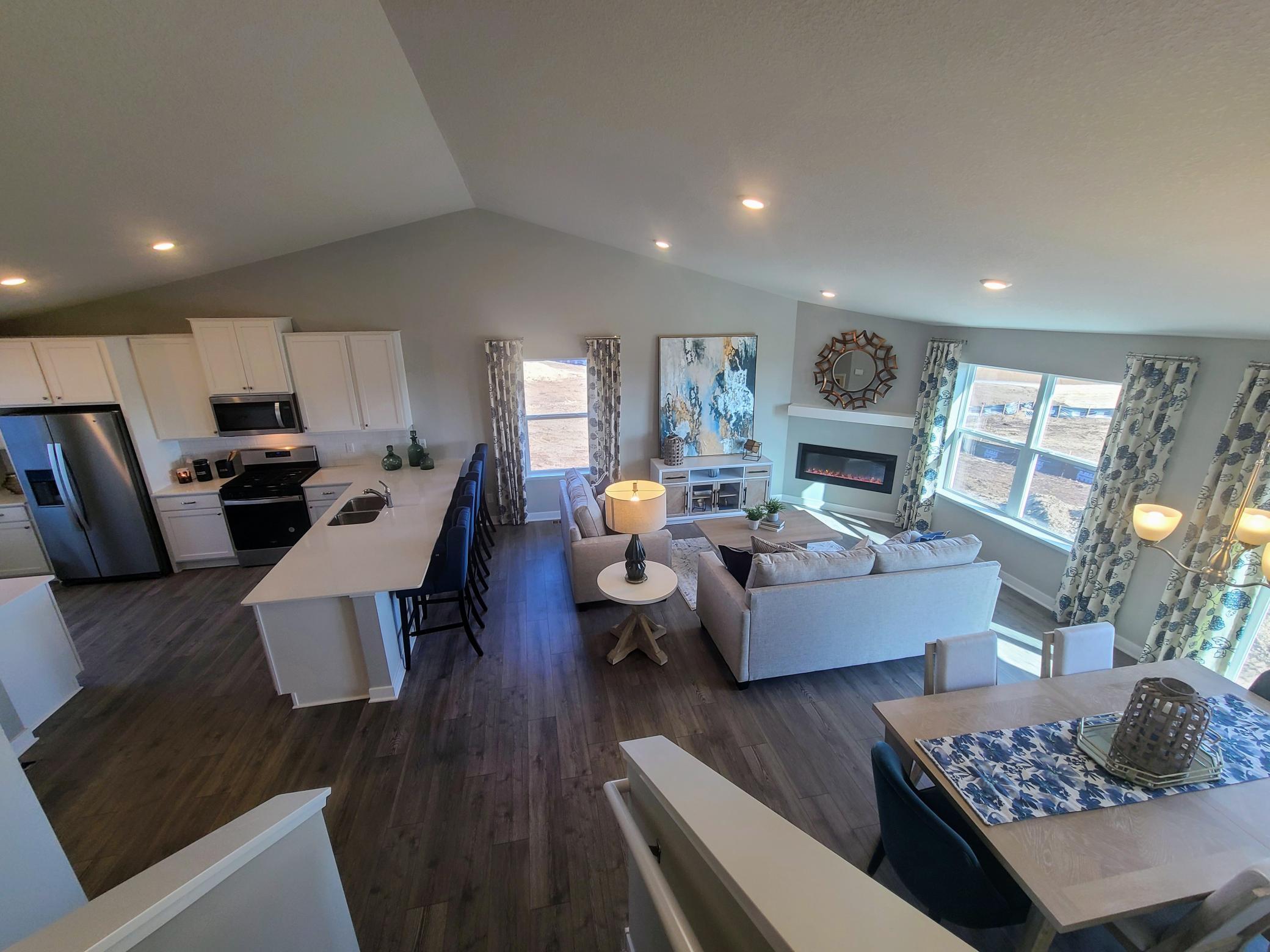 Beautiful living space with lots of windows bring in lots of natural light. Photo is of model home. Colors and options may vary. Ask Sales Agent for details.
