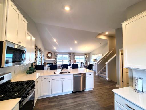 Stainless steel appliances and quartz countertops. Photo is of model home. Colors and options may vary. Ask Sales Agent for details.
