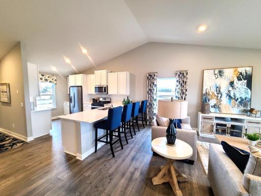 This functional kitchen boasts 42' cabinets with hardware, stainless steel appliances and quartz countertops. Photo is of model home. Colors and options may vary. Ask Sales Agent for details.