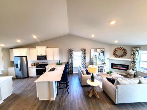 Beautiful living space with lots of windows bring in lots of natural light. Photo is of model home. Colors and options may vary. Ask Sales Agent for details.