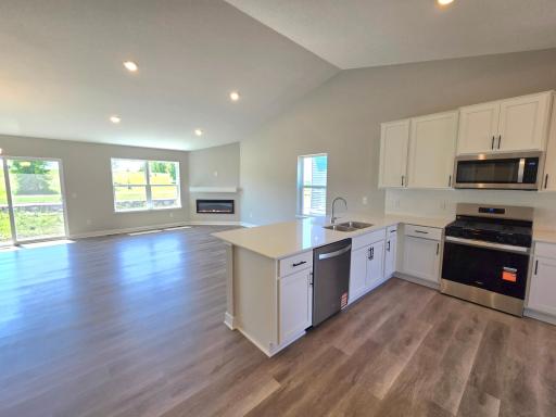 The Bryant II Kitchen shown with White cabinets at Highlands at Eagle View in Elko New Market. Photo is of actual home. Options and colors may vary. Ask Sales Agent for details.