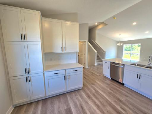 The Bryant II Kitchen shown with White cabinets at Highlands at Eagle View in Elko New Market. Photo is of actual home. Options and colors may vary. Ask Sales Agent for details.