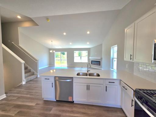 The Bryant II Kitchen shown with White cabinets at Highlands at Eagle View in Elko New Market. Photo is of actual home. Options and colors may vary. Ask Sales Agent for details.
