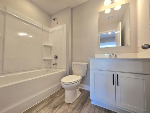 The Bryant II Lower Level Bathroom shown with White cabinets at Highlands at Eagle View in Elko New Market. Photo is of actual home. Options and colors may vary. Ask Sales Agent for details.