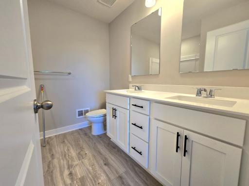 The Bryant II Primary Bathroom shown with White cabinets at Highlands at Eagle View in Elko New Market. Photo is of actual home. Options and colors may vary. Ask Sales Agent for details.