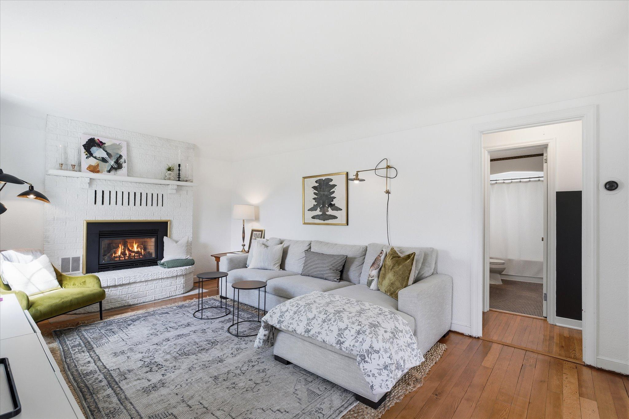 The refinished Douglas Fir floors are stunning. The gas fireplace is one of two, and Old Man Winter - remember that guy? He's no match for them!
