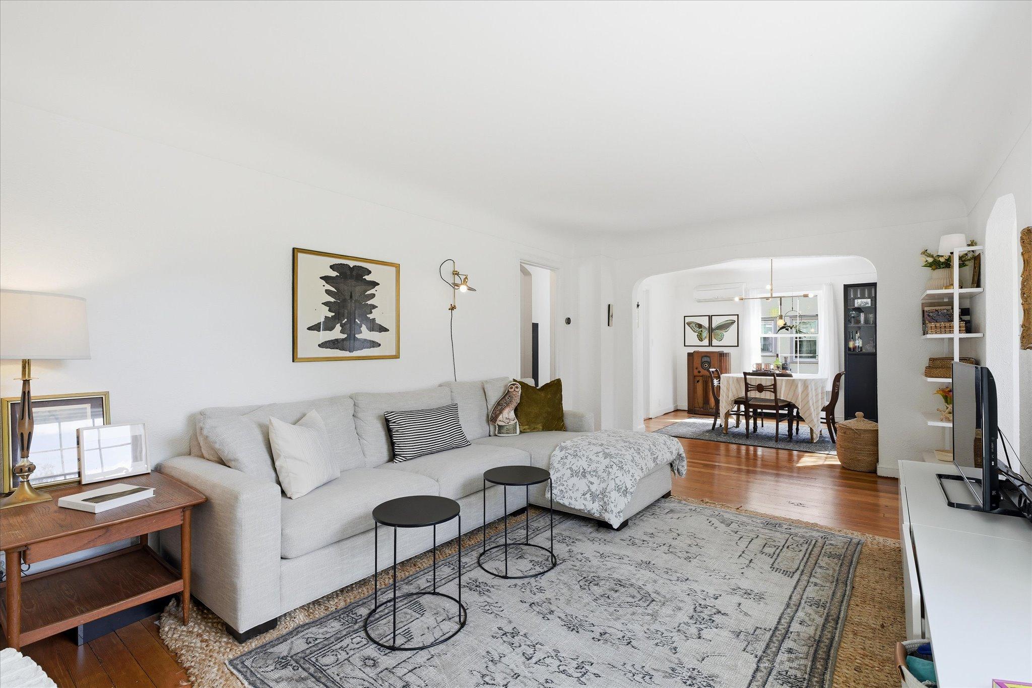 The arched opening and coved ceiling edges are great hallmarks of the period - timeless.