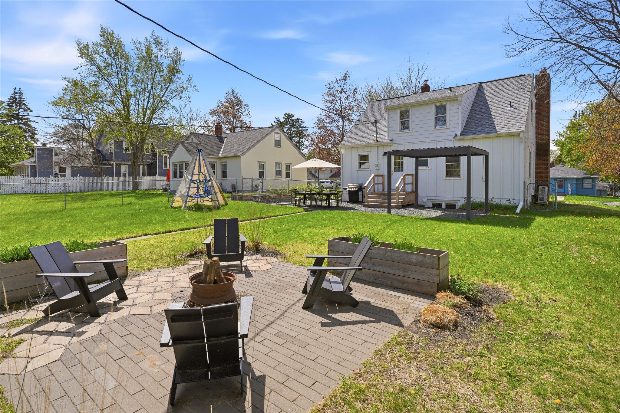 The fully fenced, flat, square and large back yard has plenty of great improvements including TWO patios!