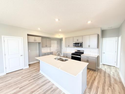Photo of actual home: Light Grey Cabinets with dark hardware