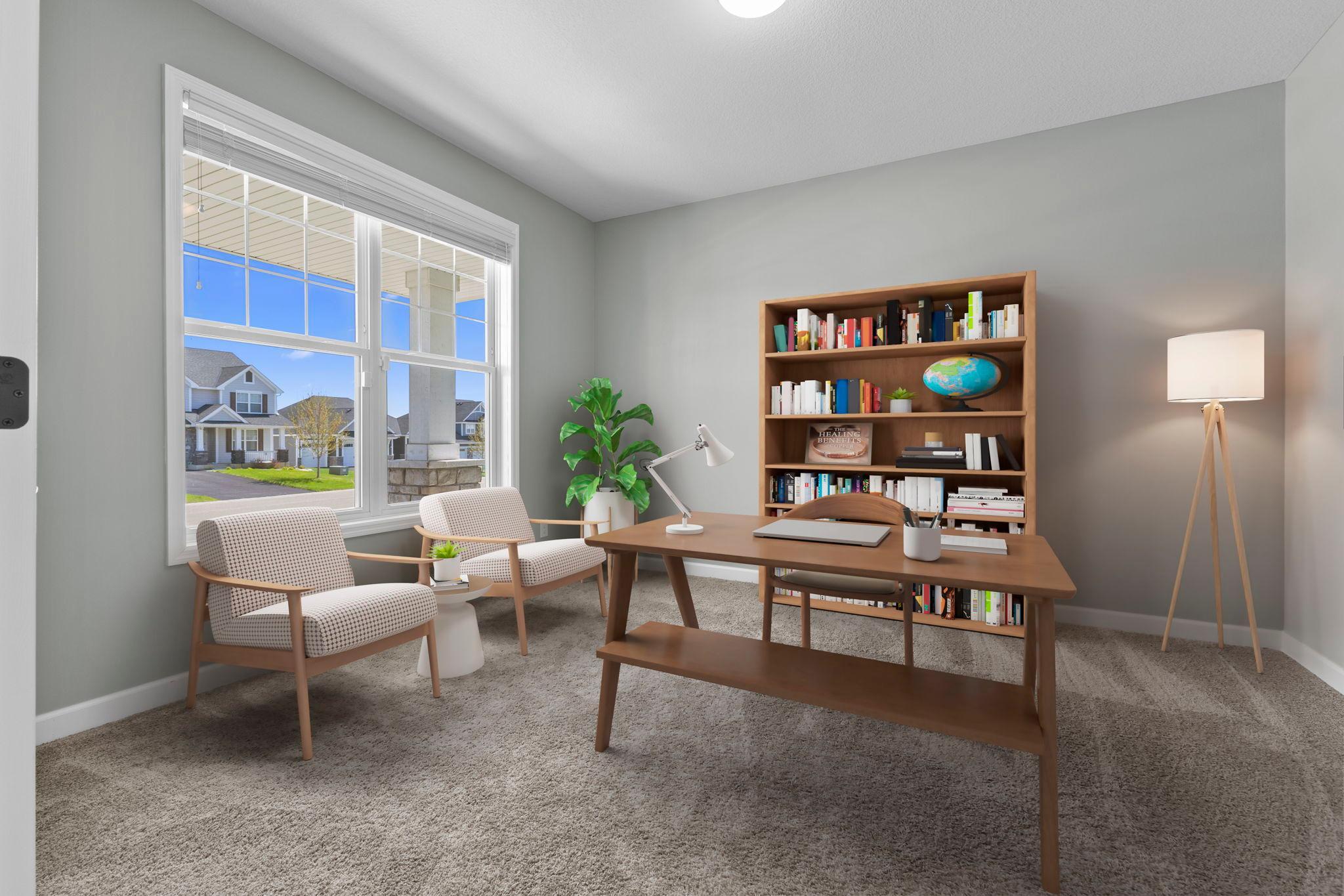 Just off the foyer is a roomy den- perfect for an office space! (virtually staged)