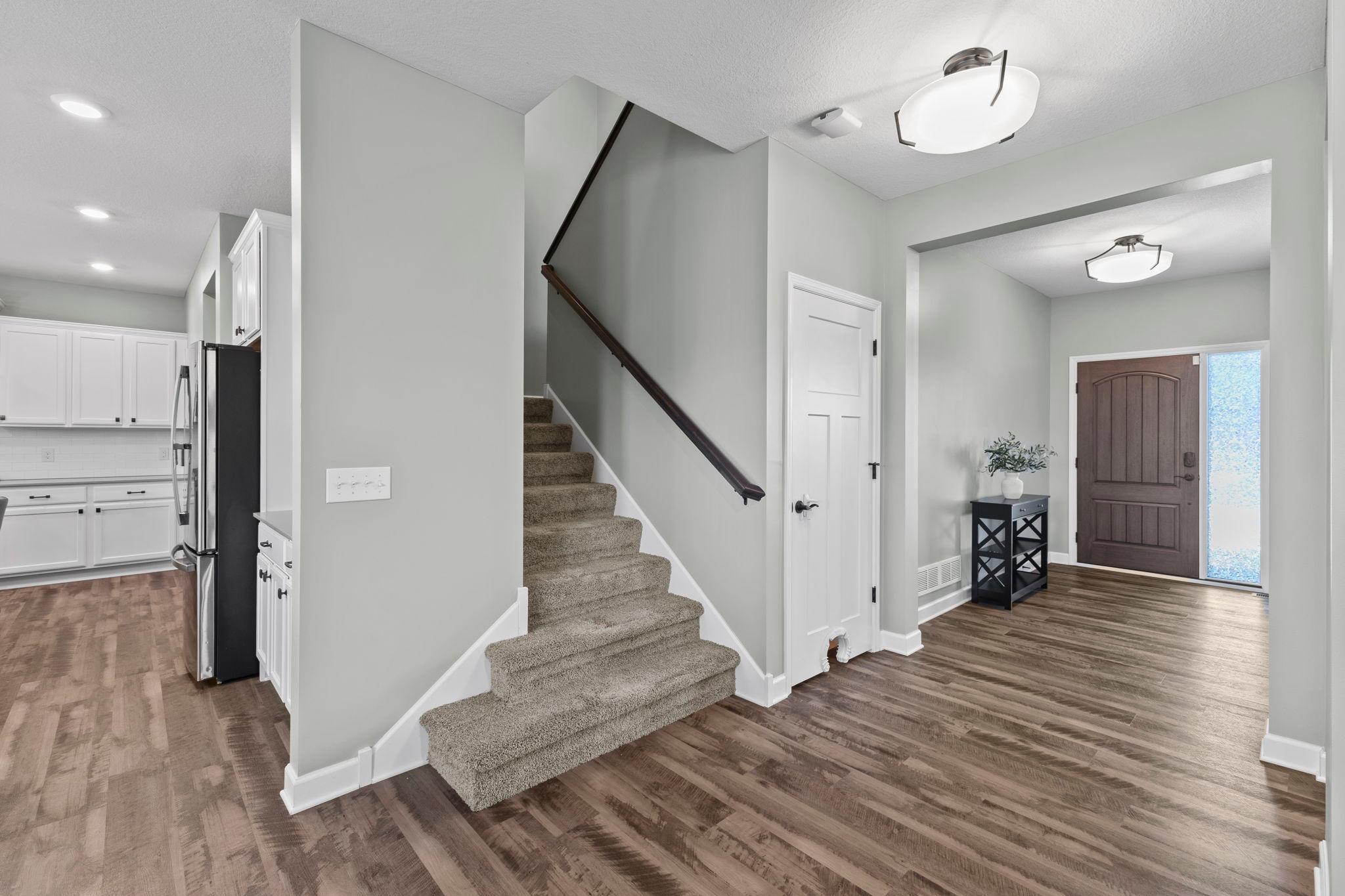 Beaming, durable, vinyl flooring throughout the main-level!
