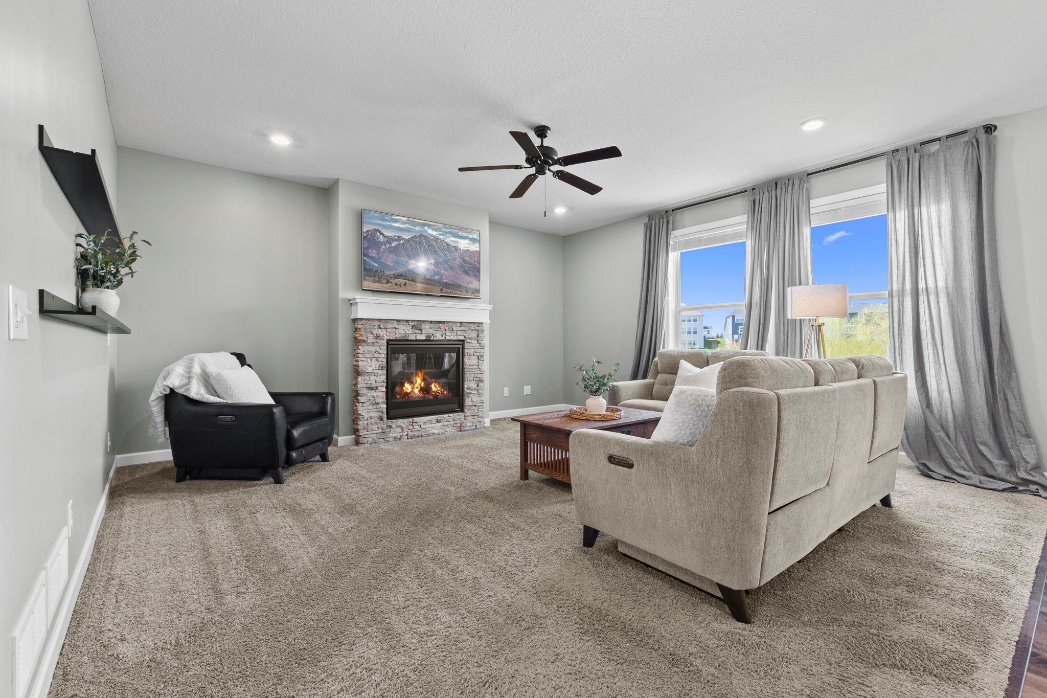 Gorgeous, stone gas-fireplace in the living room.