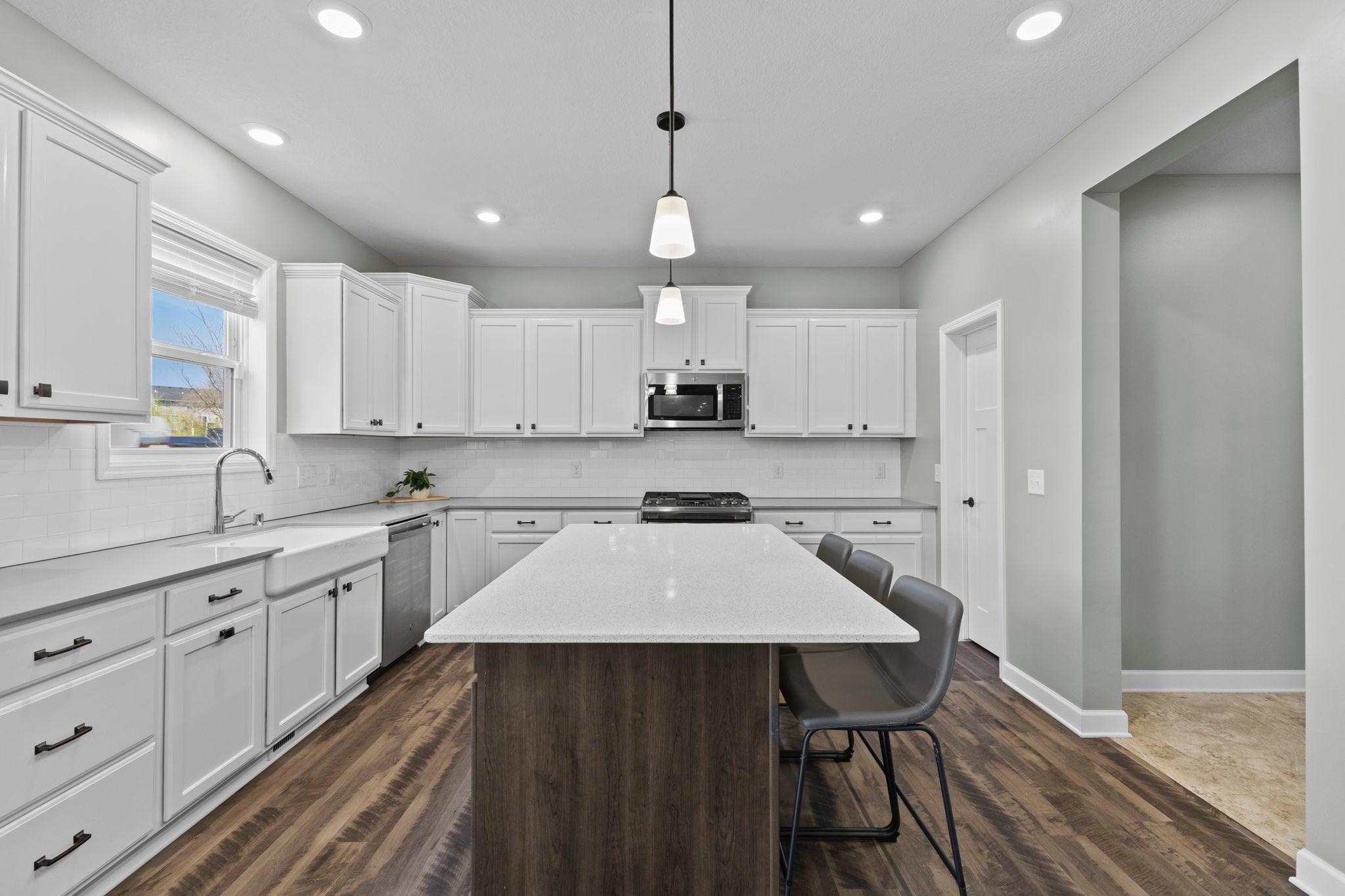 Beautiful kitchen with a large island & quartz countertops!