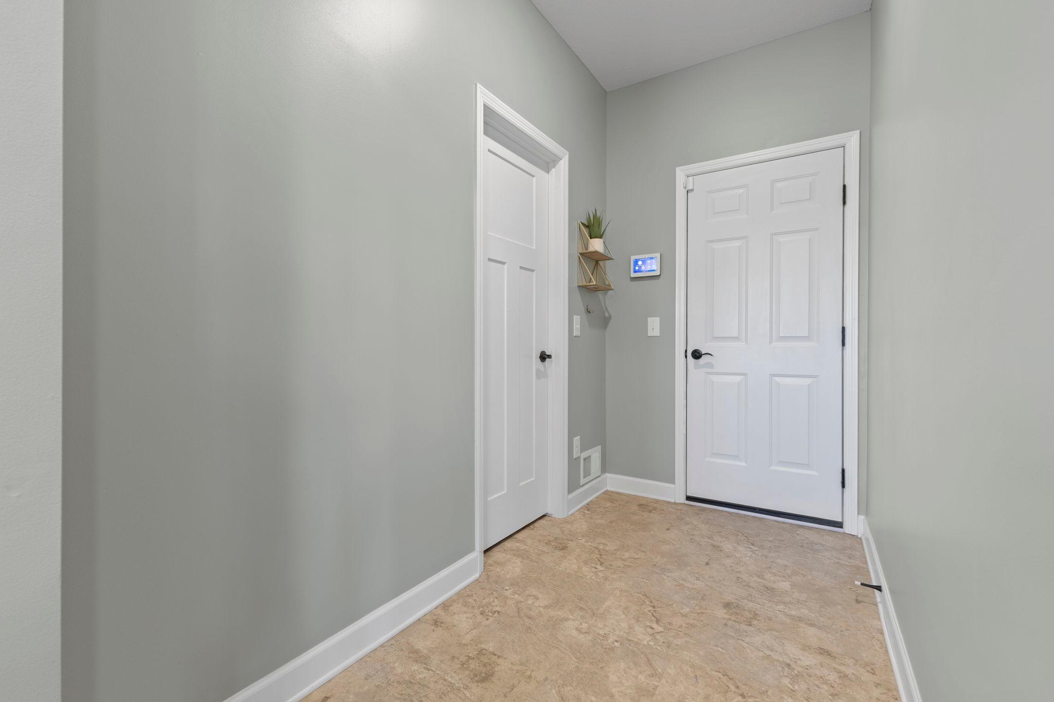 Mudroom off the kitchen- comes with a spacious closet & connects to your finished garage with epoxy flooring!