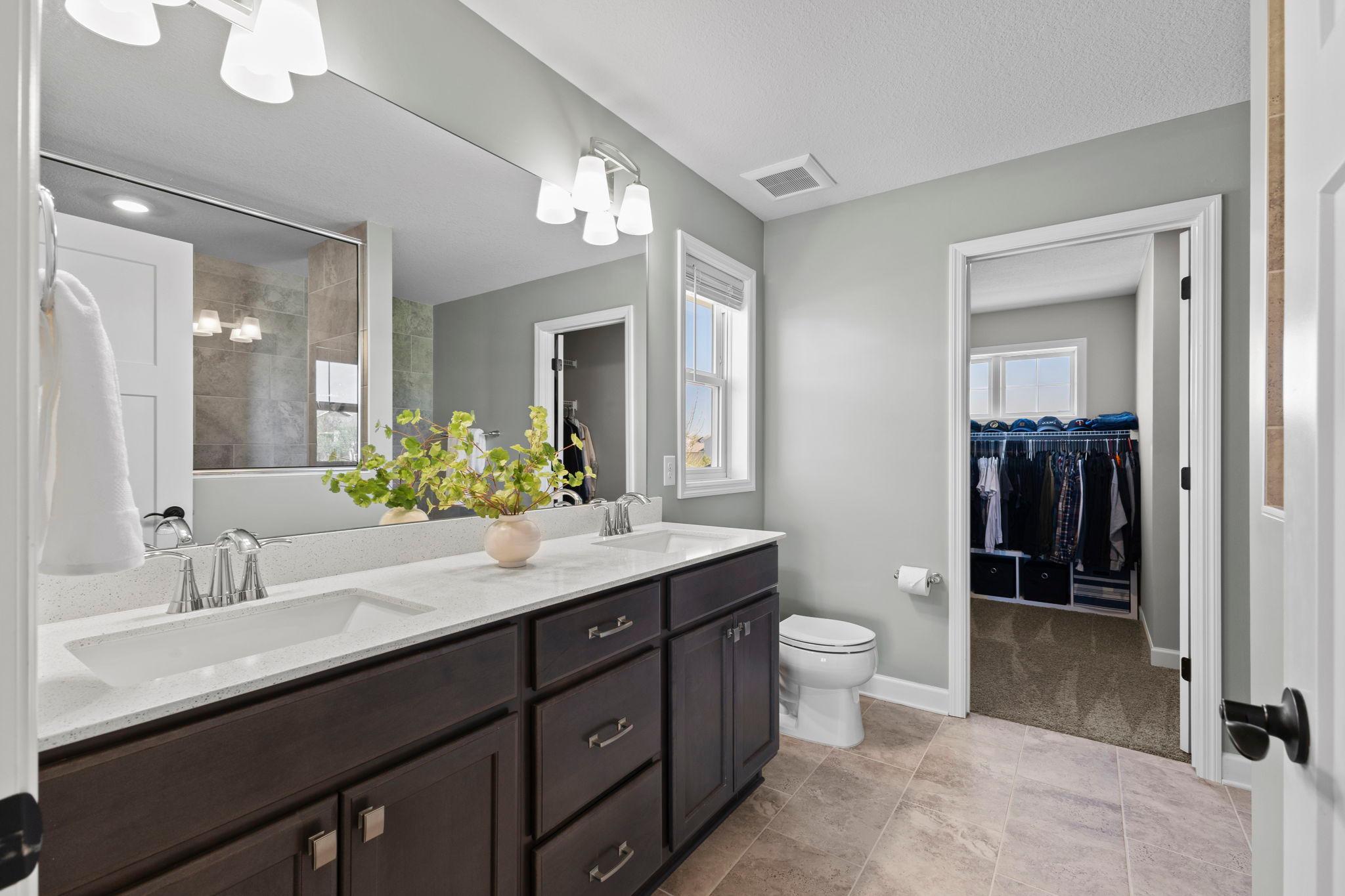 Includes a gorgeous bath ensuite w/ a double-sink vanity & tile floor!