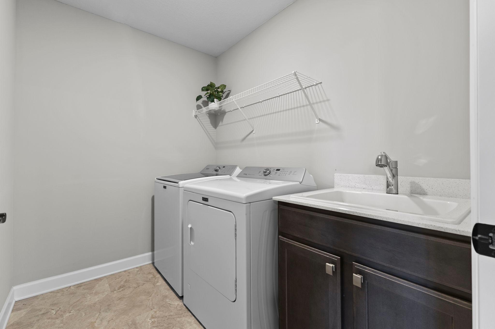 Laundry room upstairs with sink.. convenient!