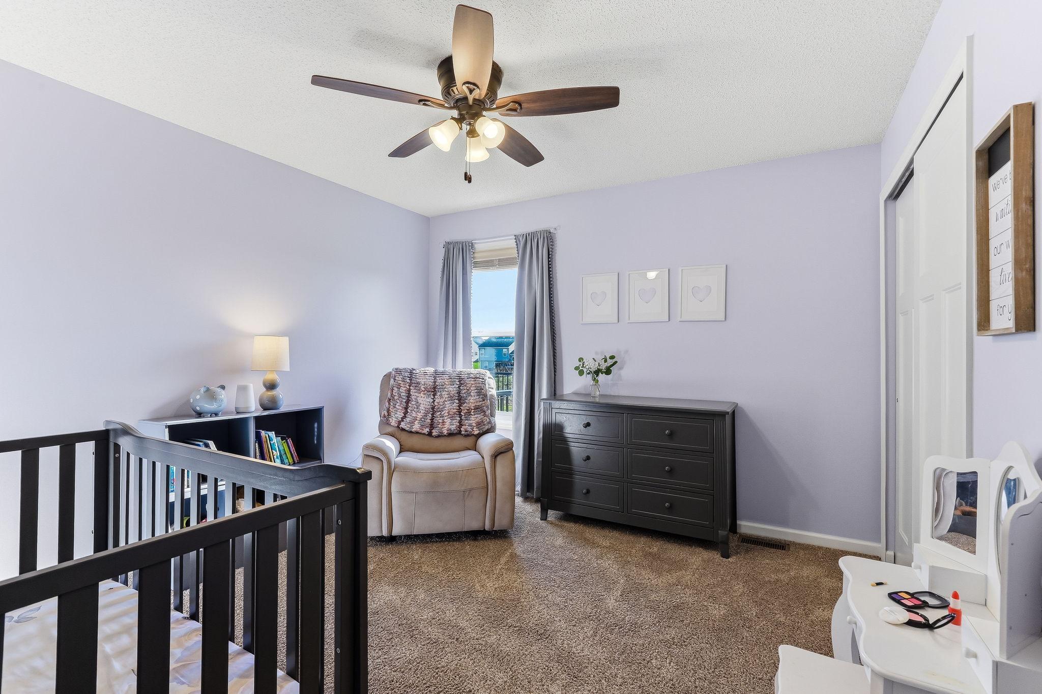 Comfortable and well-sized second bedroom located on the upper level.