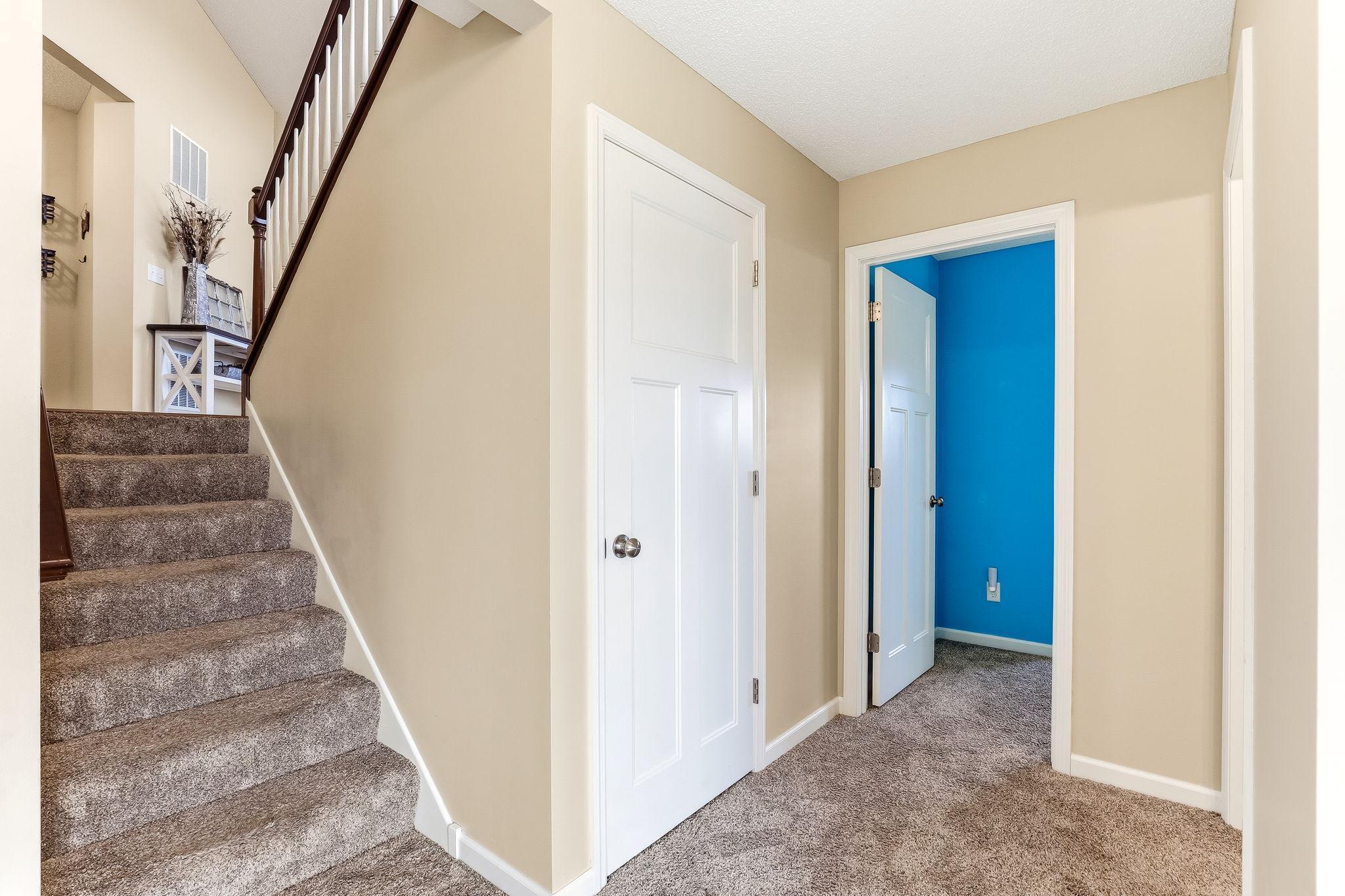 Lower level offers a spacious family room perfect for relaxing or entertaining, along with a comfortable bedroom and a full bathroom.