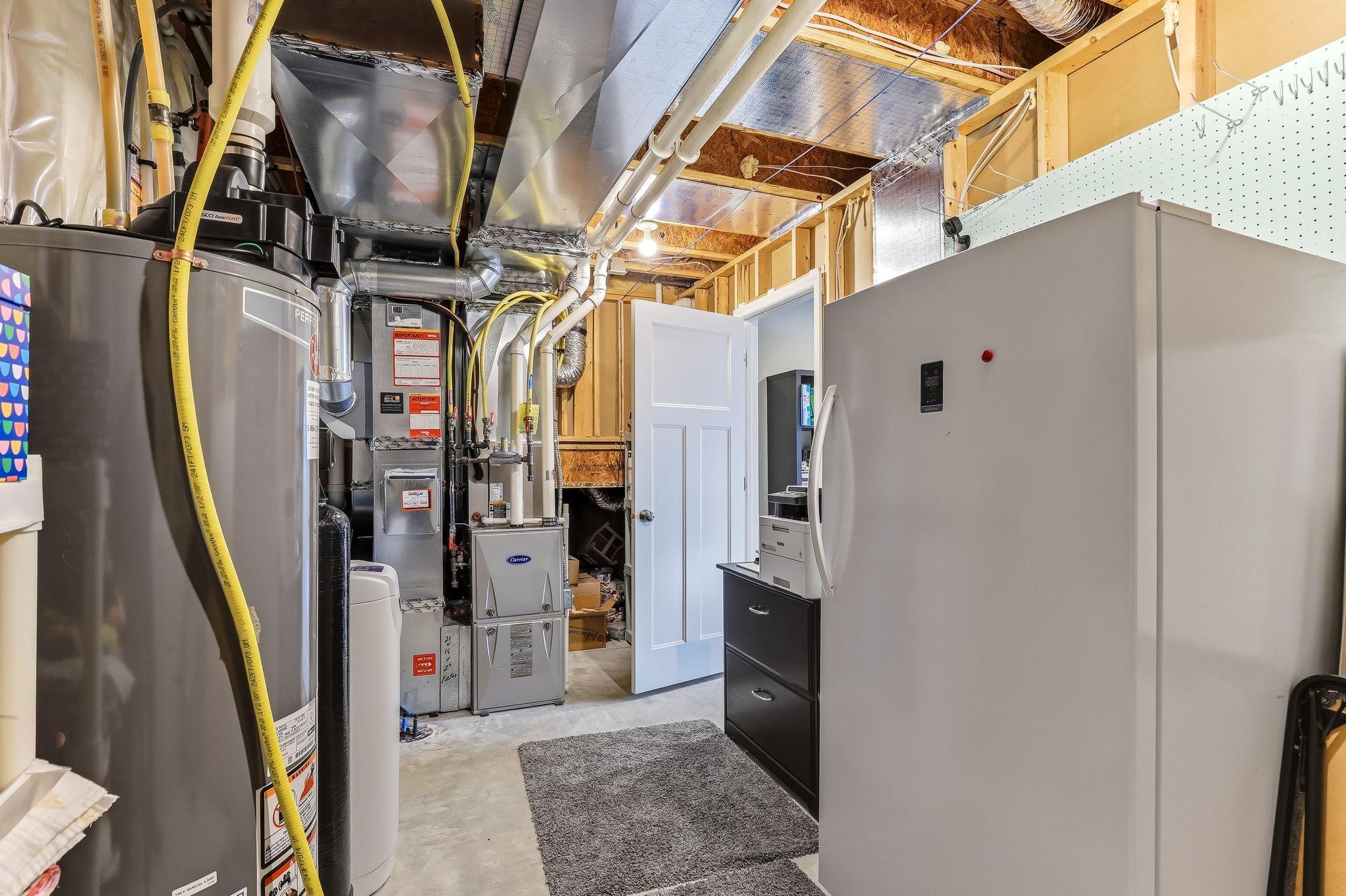 Functional utility room offering practical space for home systems and additional storage needs