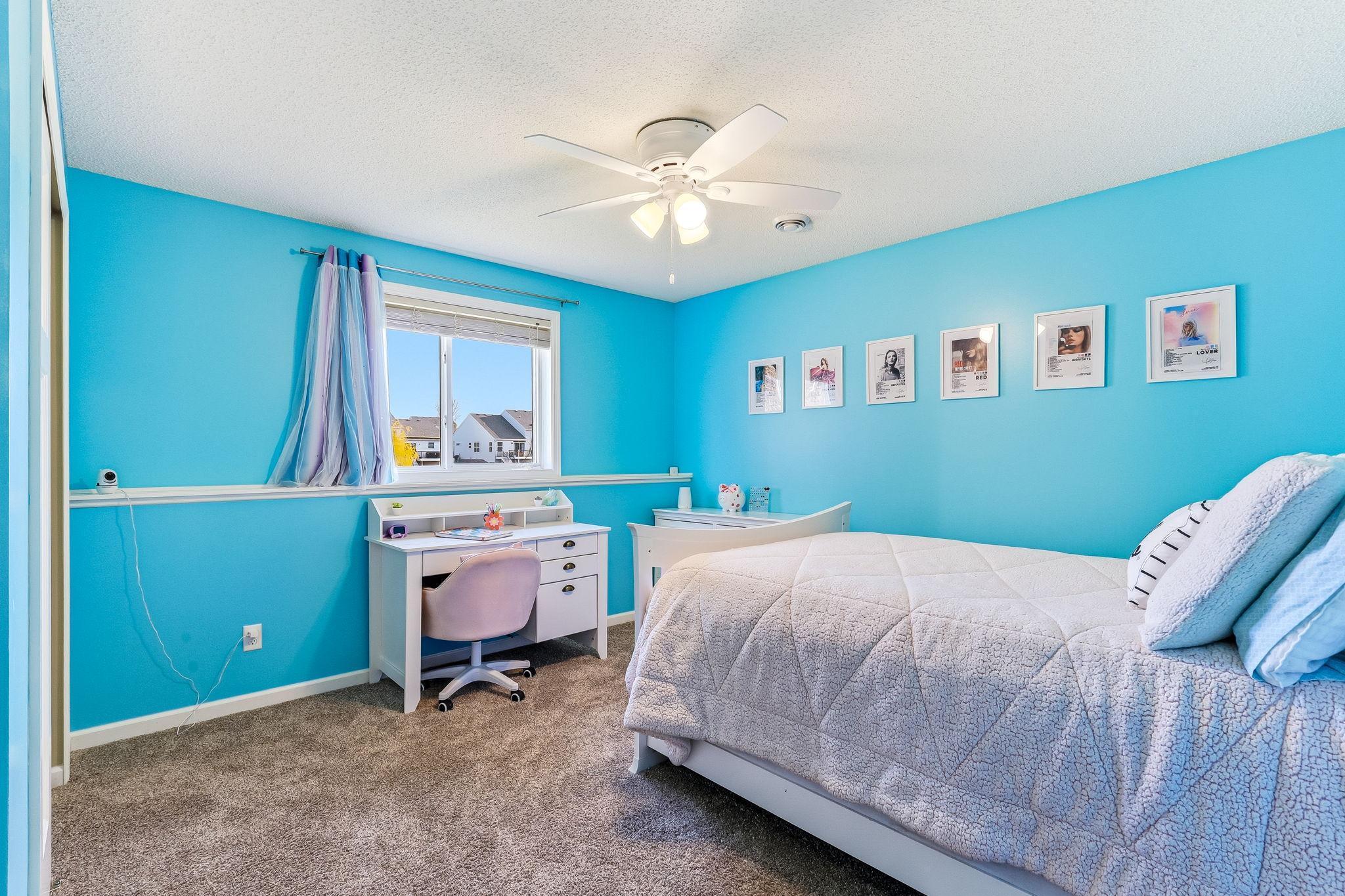 Fourth bedroom in the lower level provides an ideal setup for guests, extended living, or a private retreat.