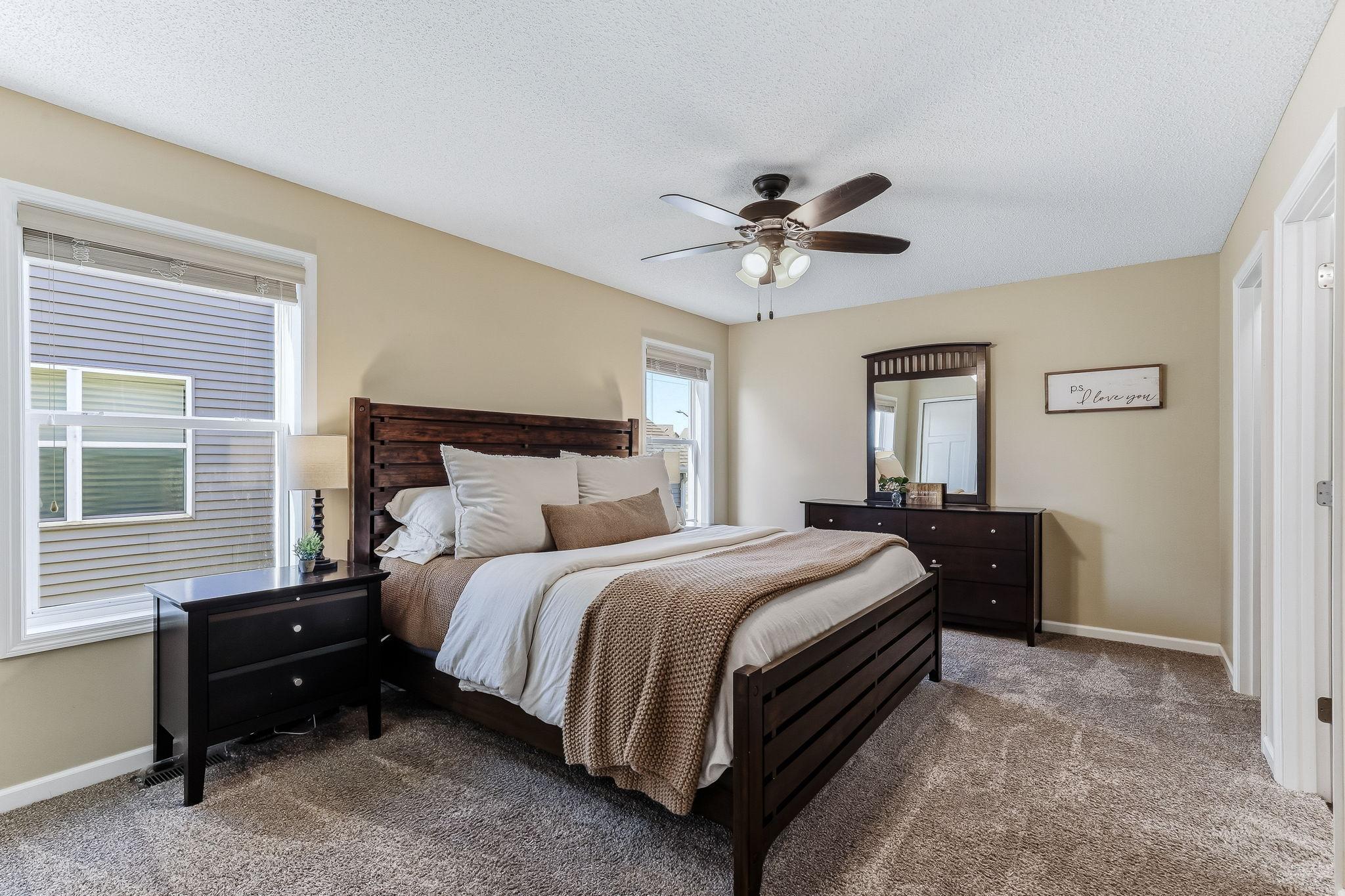 Spacious primary suite designed for comfort and relaxation, featuring a peaceful retreat feel with ample room for furnishings.