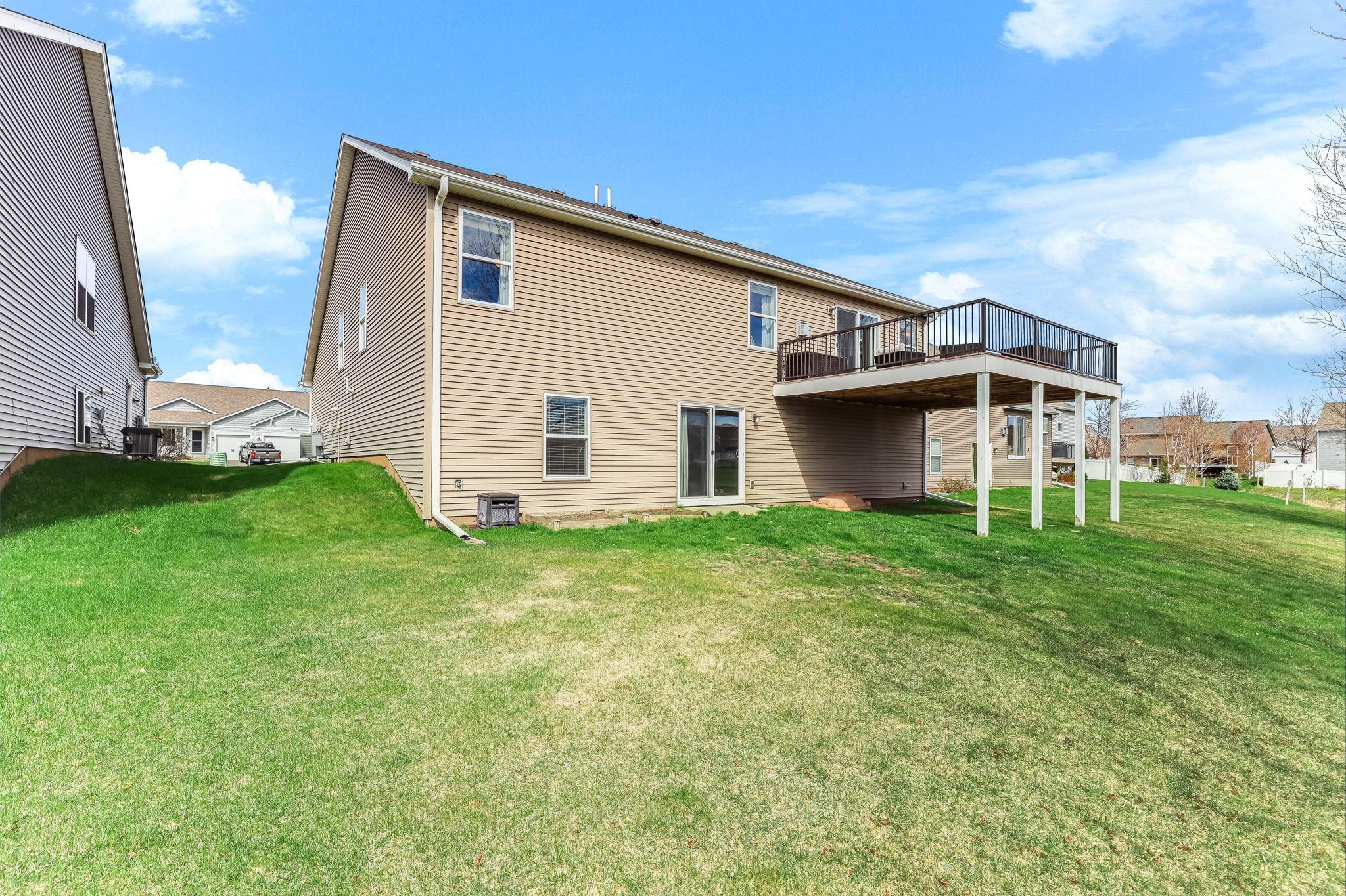 In-ground sprinkler system will make keeping your grass green all summer an breeze!