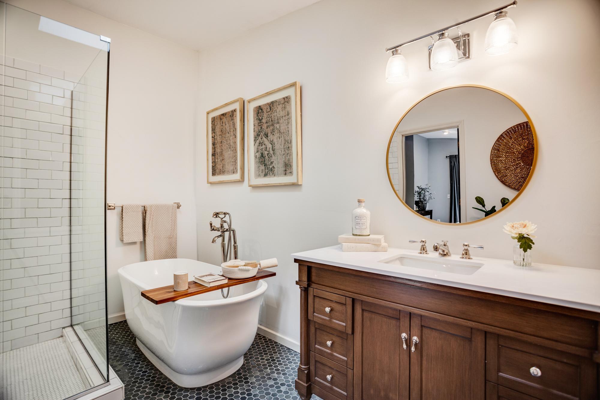 The ensuite bathroom was fully remodeled in 2024 with a walk-in shower, freestanding tub, polished nickel taps and fixtures, and hex tile flooring.