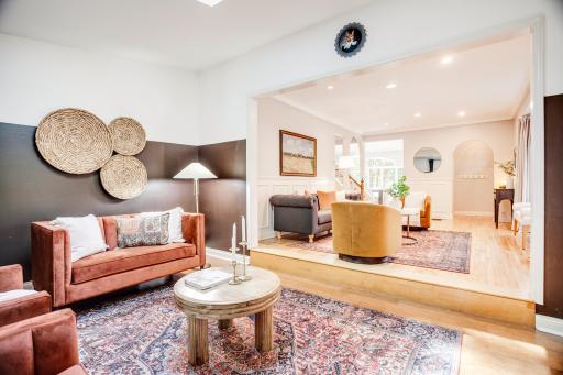 Main-level den or sitting room with newer skylights throughout the home.