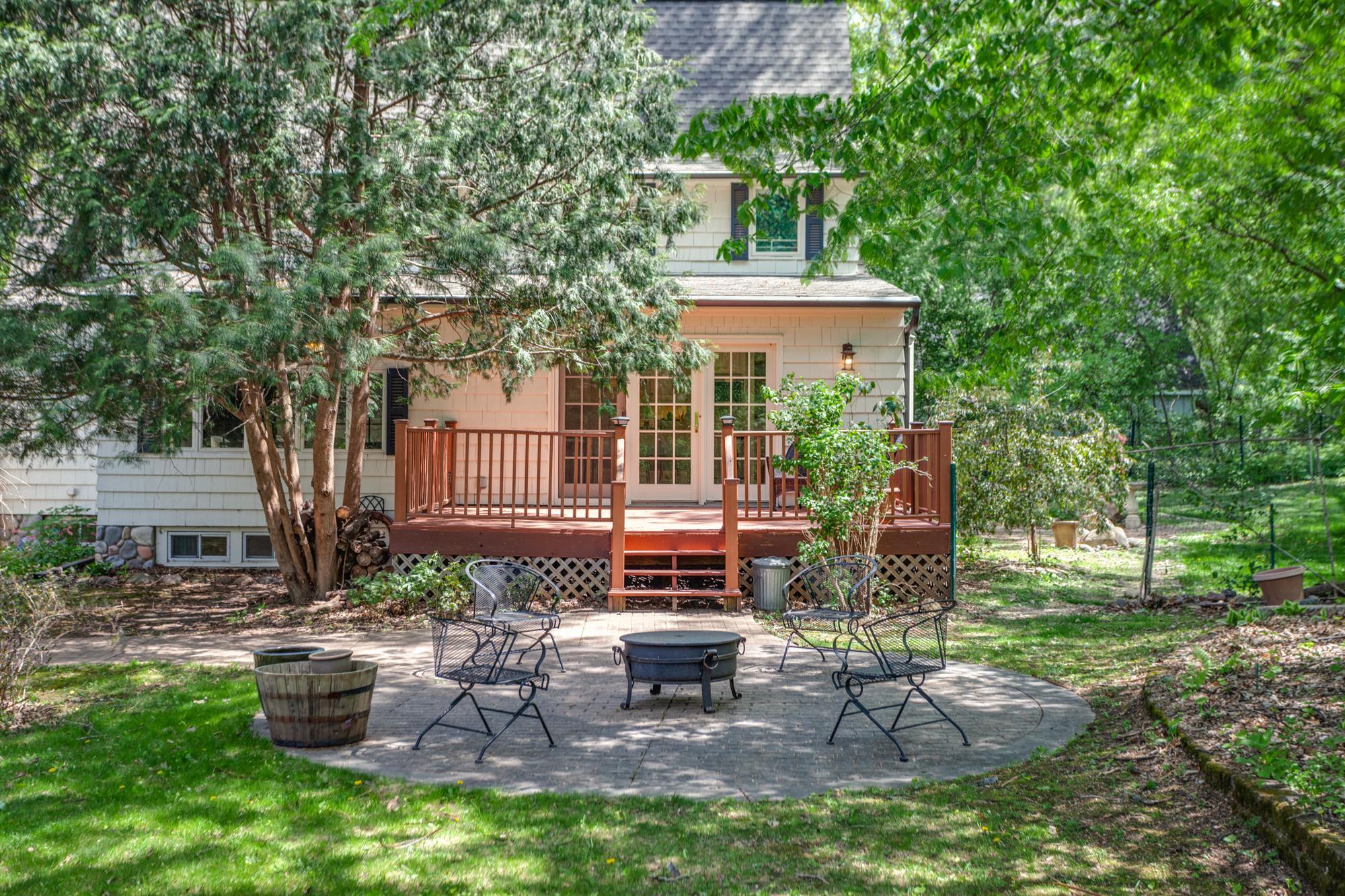 Brick patio and deck located off the kitchen