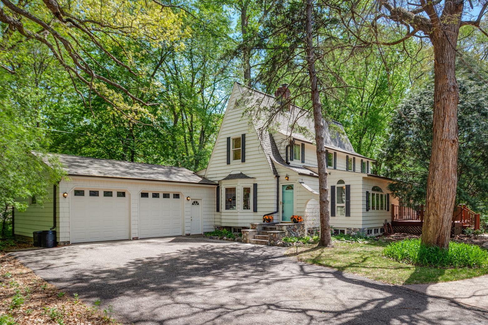 Welcome to 15319 Lake Street Extension. This 4 bed, 4 bath residence sits on a private 0.72-acre setting in the Minnetonka School District.