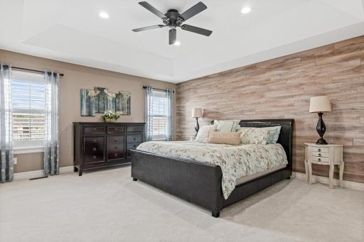 Huge private primary bedroom with new carpet, updated paint and natural light.
