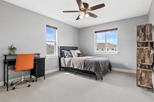 One of four bedrooms located upstairs. Lots of windows for bright, natural light and new carpet.