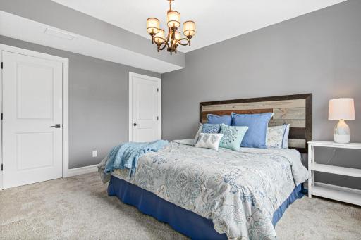 Spacious 5th bedroom in the lower level with 2 closets and bright lighting. Perfect for family or friends that plan to stay overnight. Overlooks the beautiful backyard.