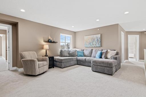 Open, bright loft is located at the top of the stairs- overlooks the living room and is a great place to watch a movie- read books or take a nap. New carpet throughout the upper level.