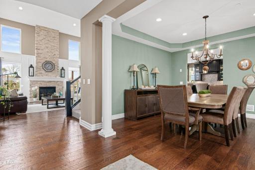 Upon entering the home- your views are dramatic and impressive. Formal dining on your right and impressive two-story living room beyond with walls of windows.