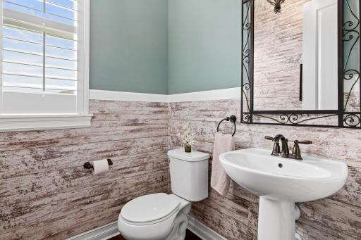 Half bathroom located near the private office and foyer- private and tucked away.