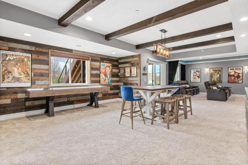 Want to have some fun? Head downstairs to the ultimate game and movie room. This space walks out to the patio below and is a destination for FUN!