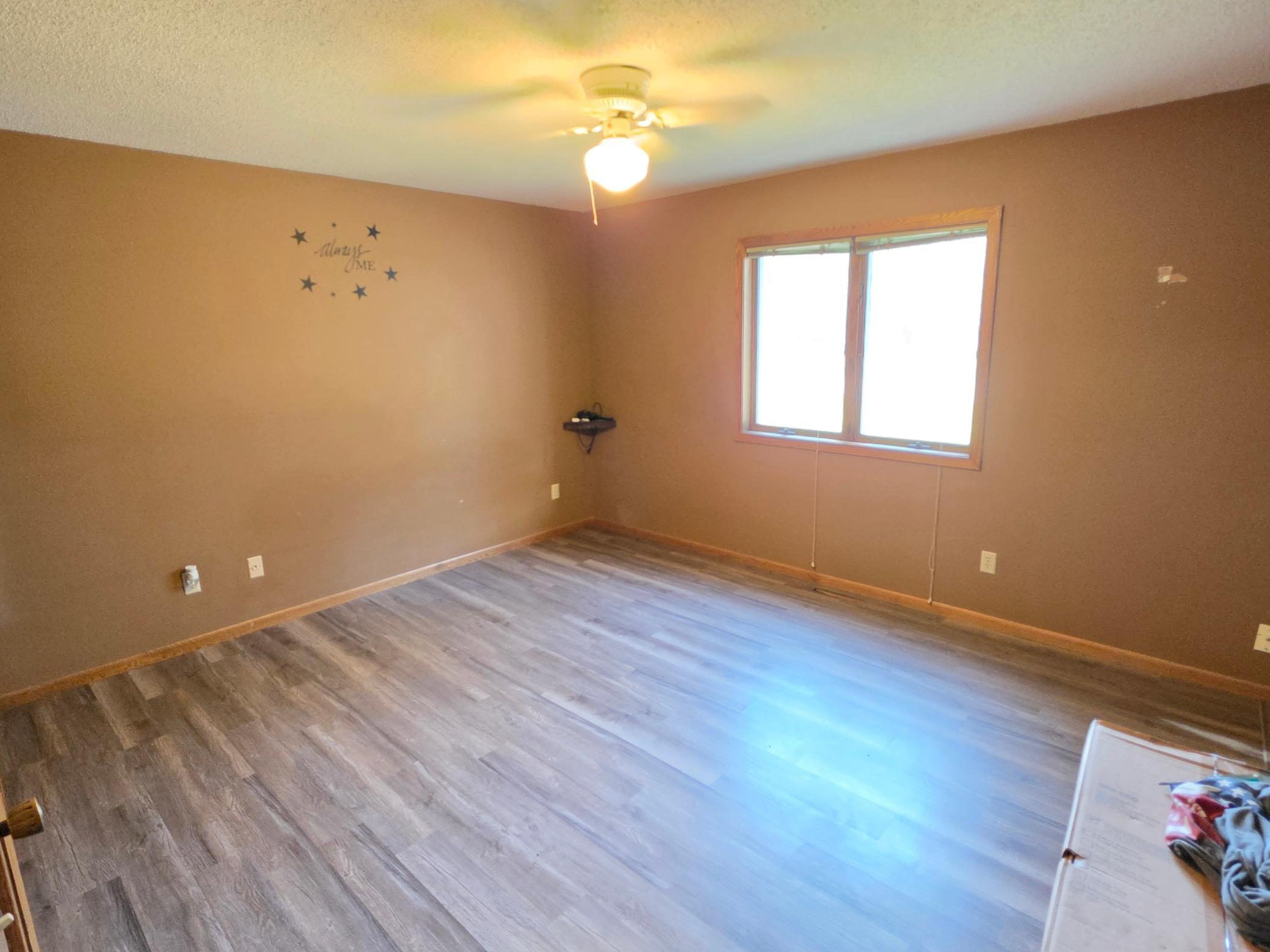 Large, Primary bedroom with new flooring!
