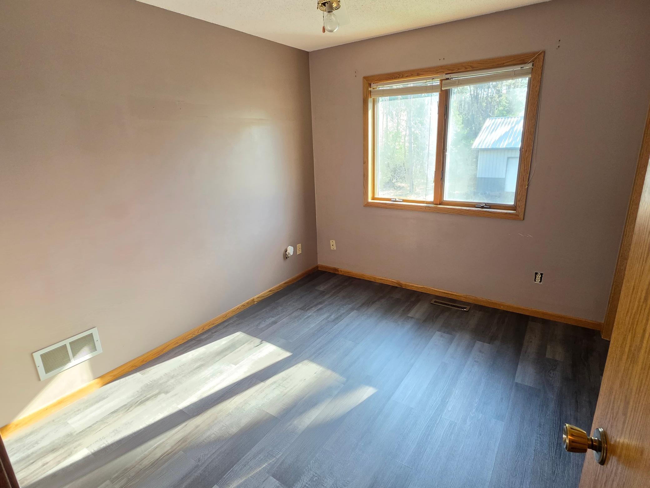 Upstairs second bedroom with new flooring