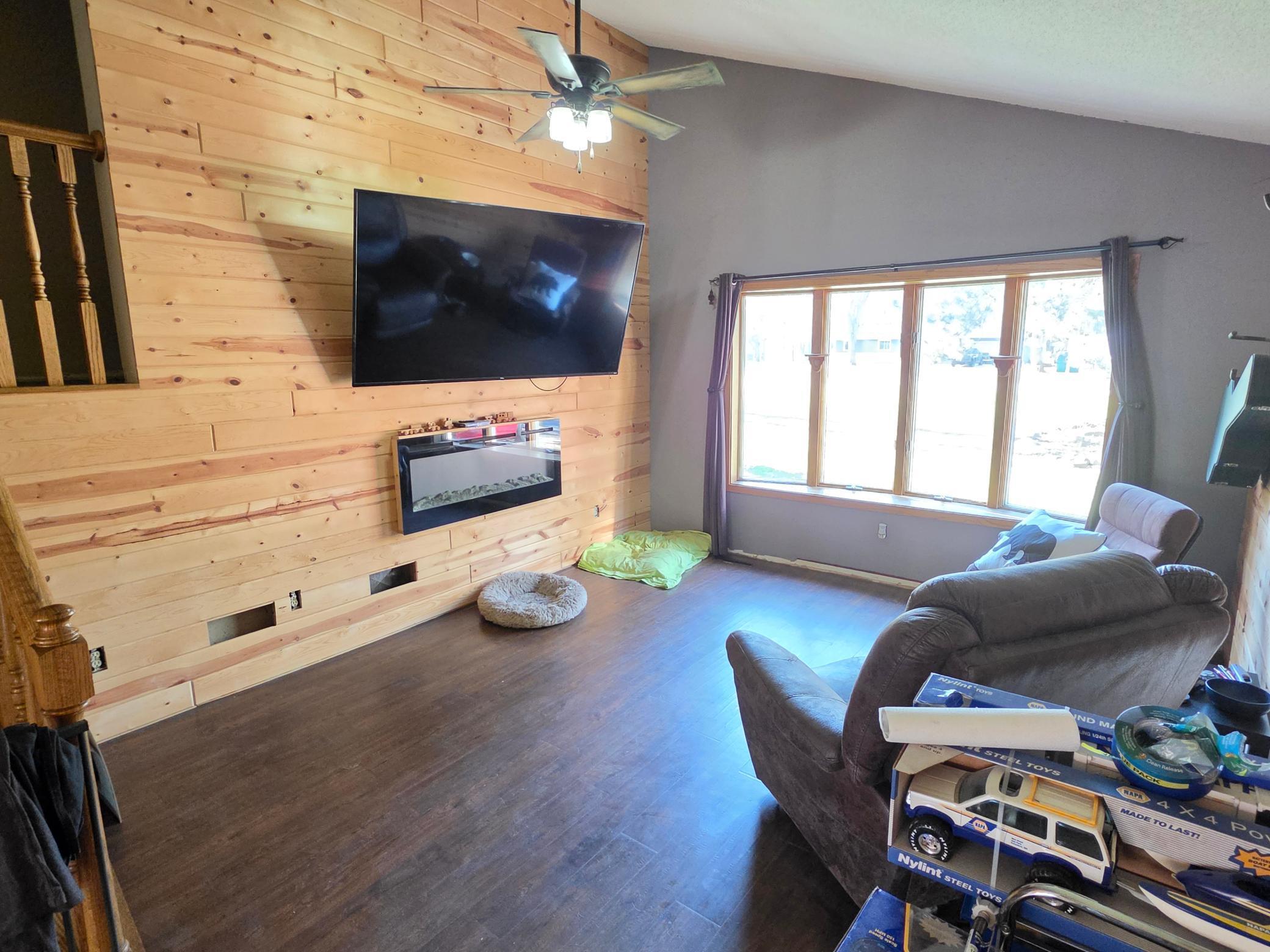 New wood wall and fireplace in living room
