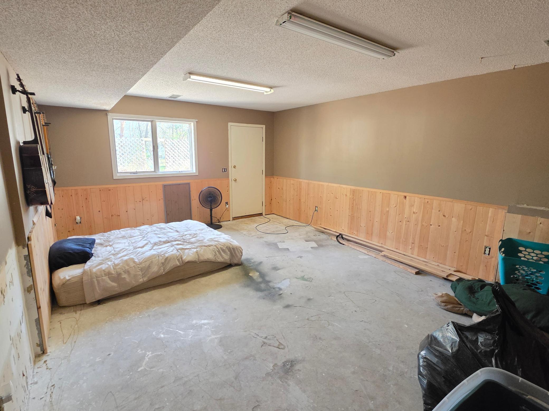Lower level family room. Flooring has been removed, but not yet redone.