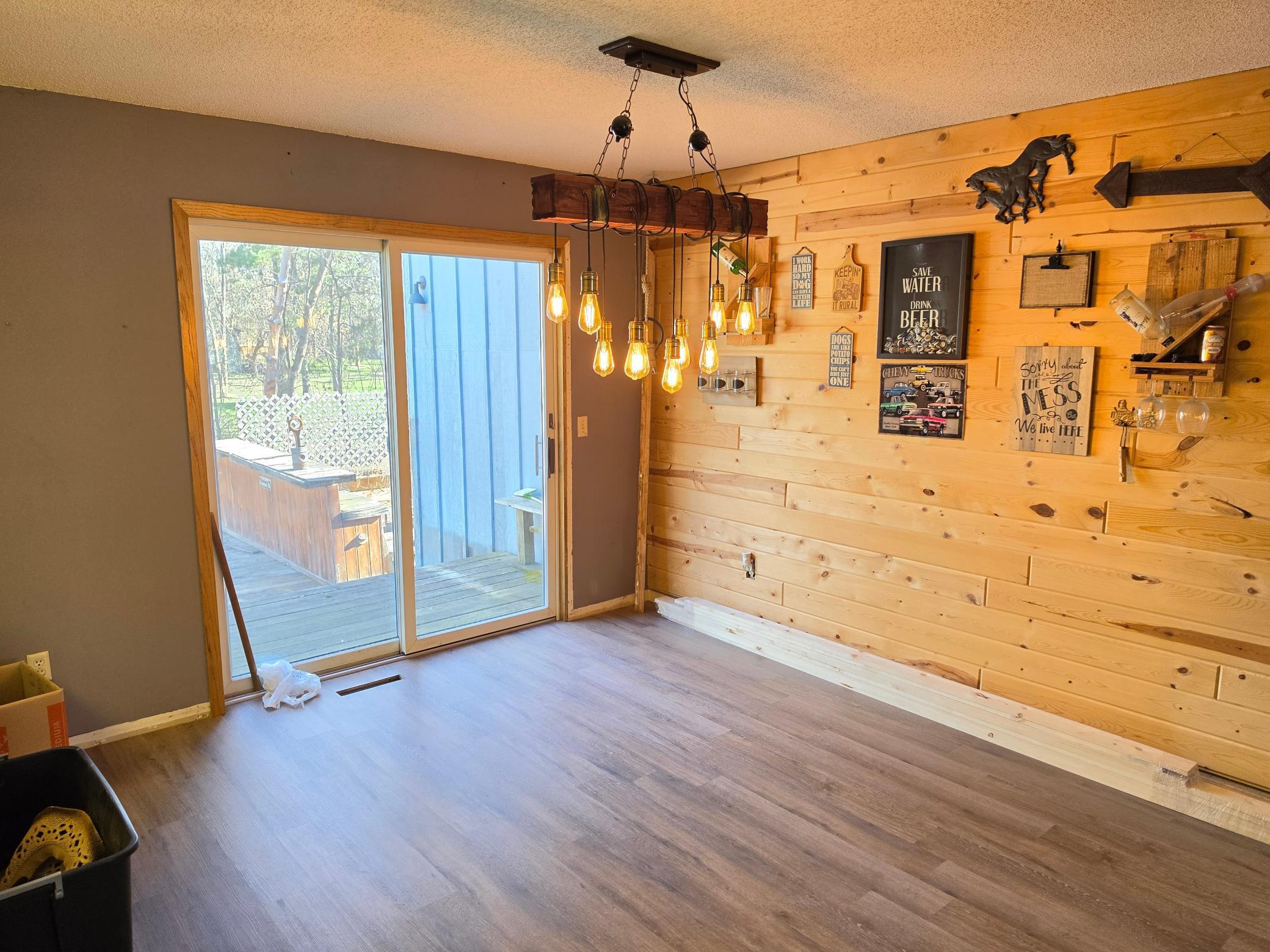 New light, wall, and flooring in dining room