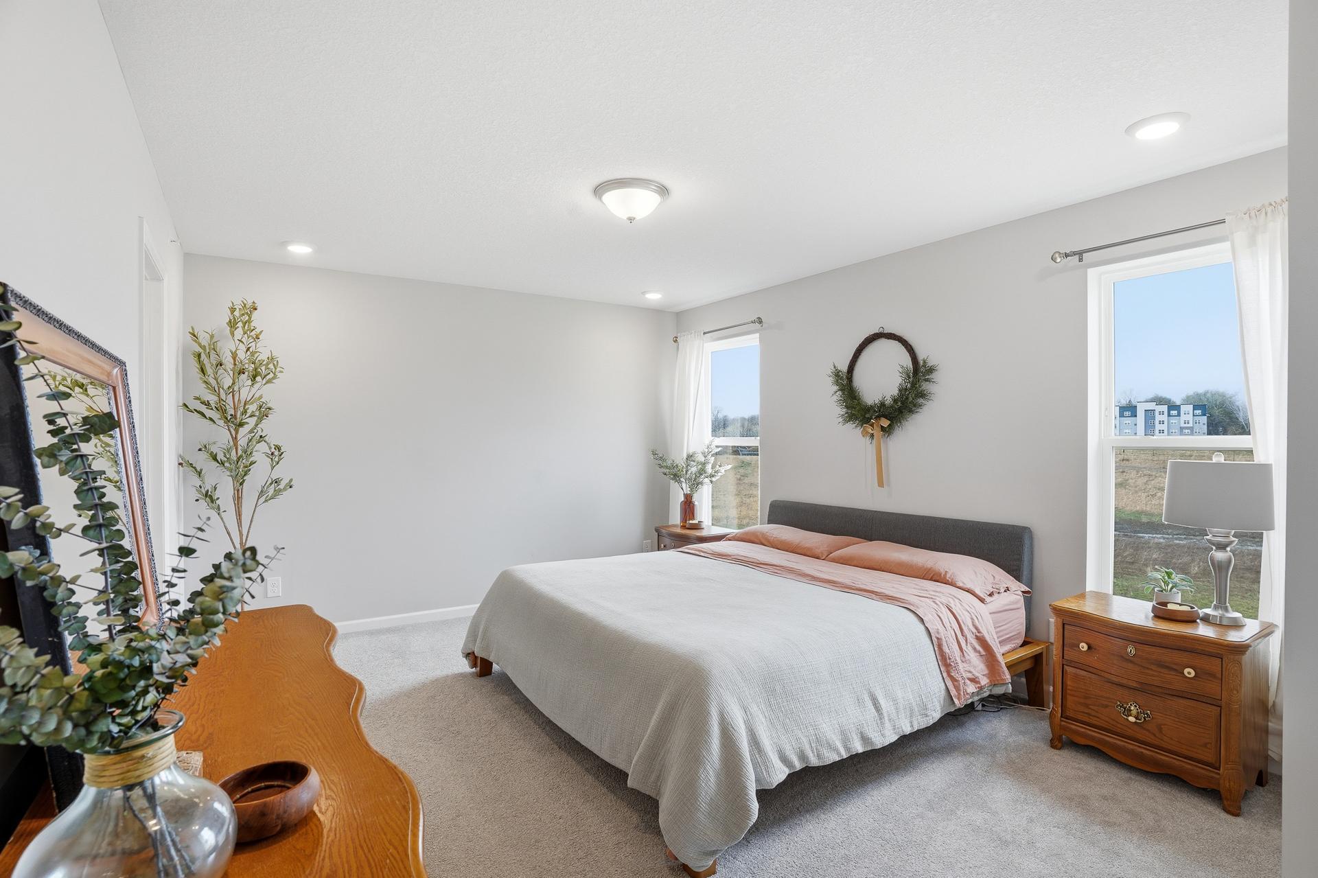 Spacious primary bedroom with a large walk-in closet
