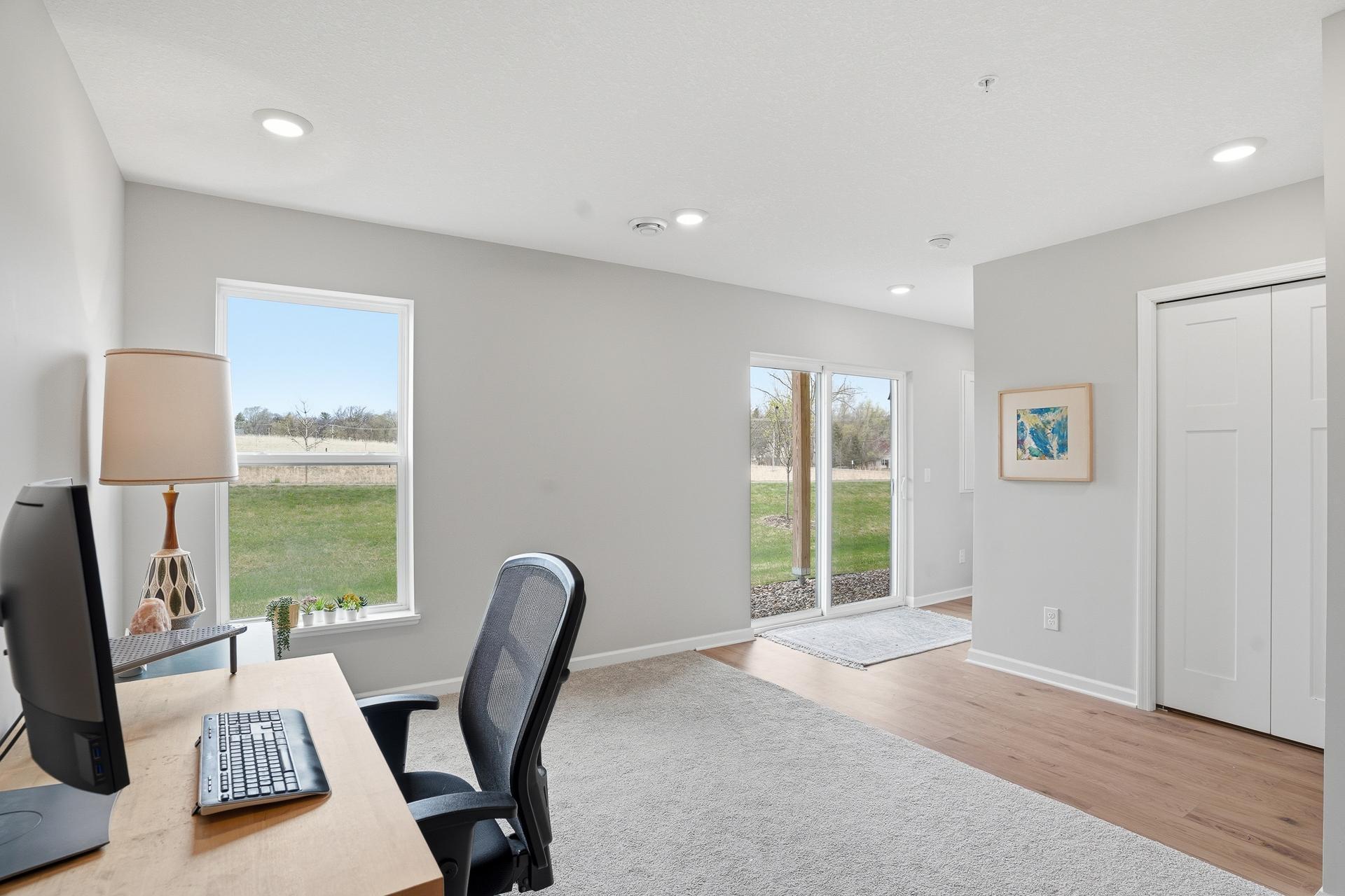 A townhome with a finished walk-out lower level! This is a perfect multi-functional area for a home office, additional family room or work-out room.