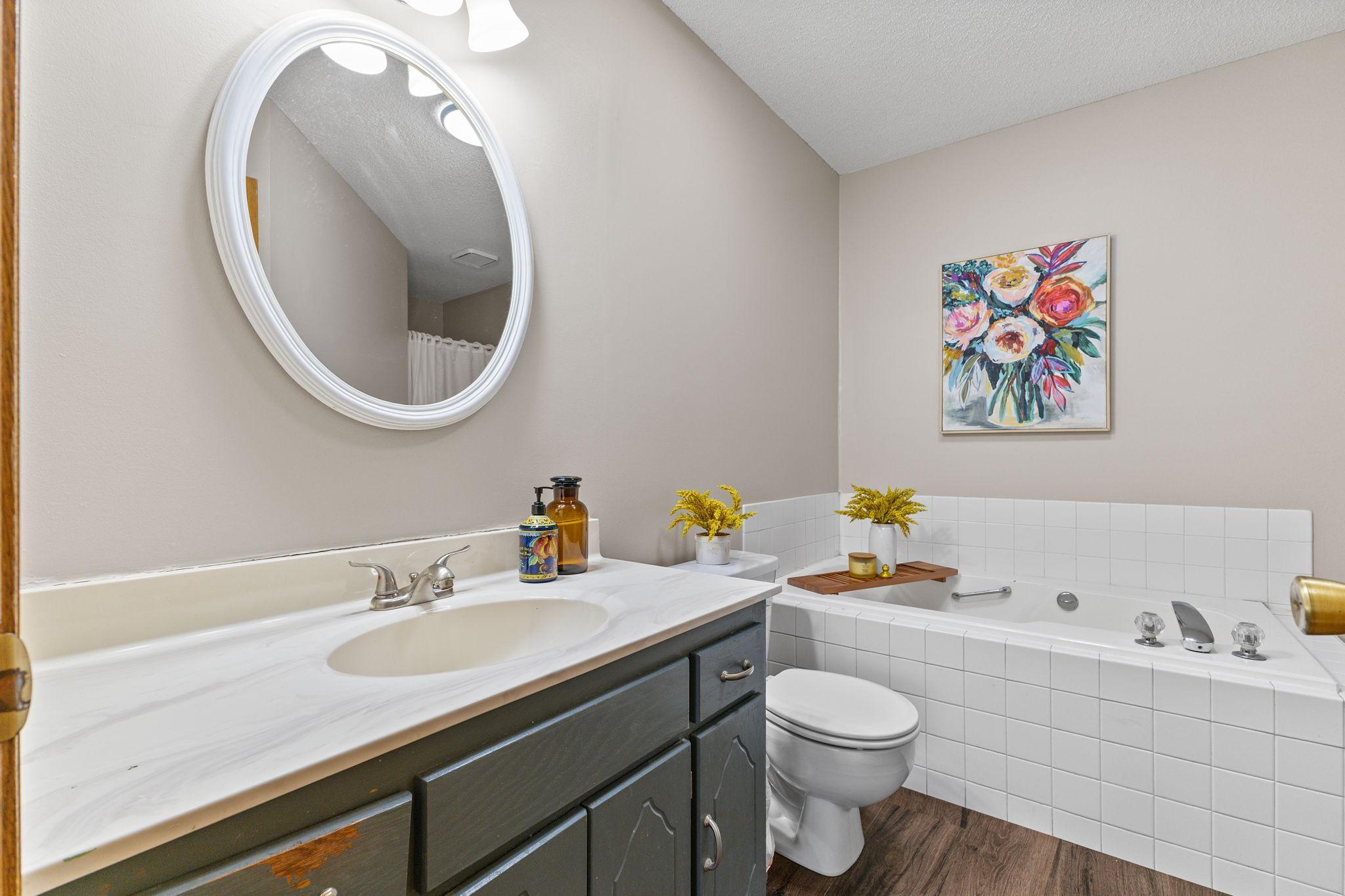 Another beautiful space with a separate tub and walk-in shower.