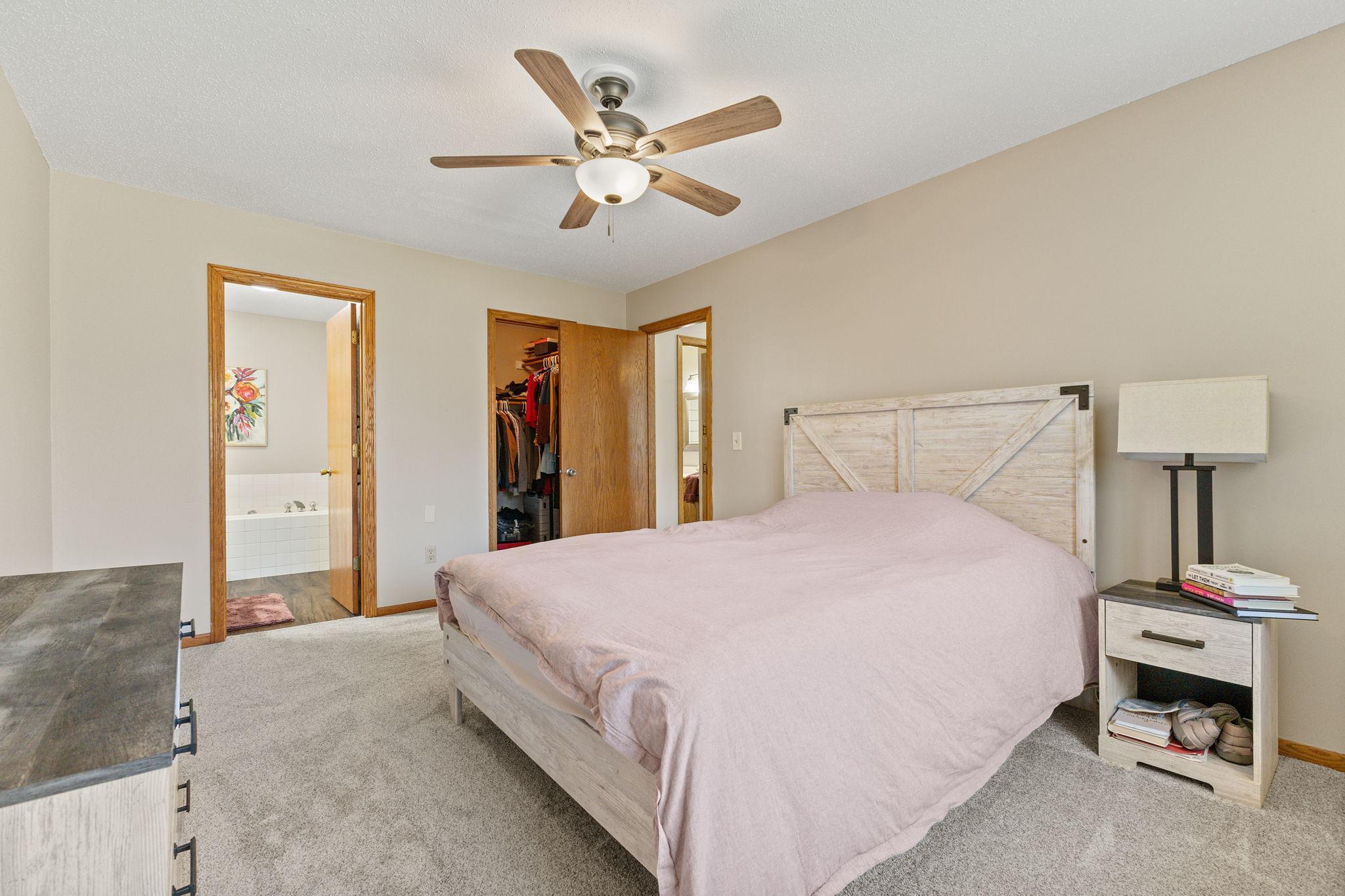 The primary bedroom also offers a private full bathroom and walk-in closet.